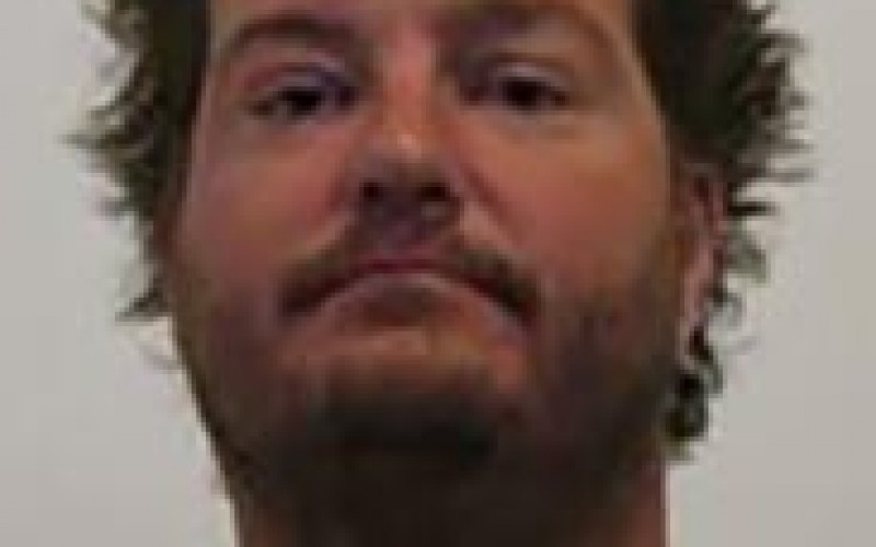 Waving Loaded Gun at Dog Earns Arrest
