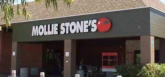 Woman robber charges from store into the arms of police