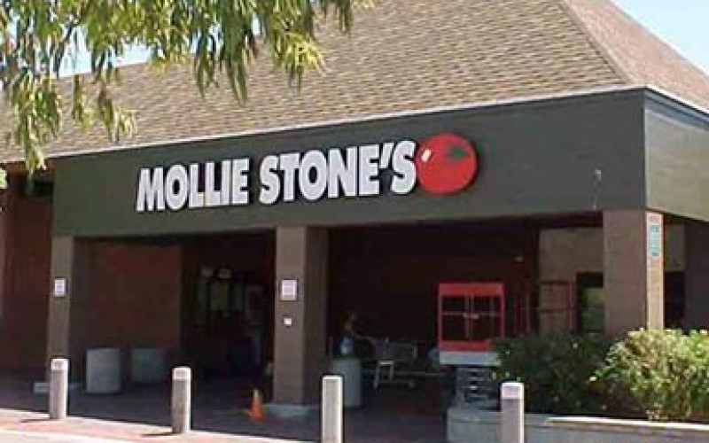 Woman robber charges from store into the arms of police