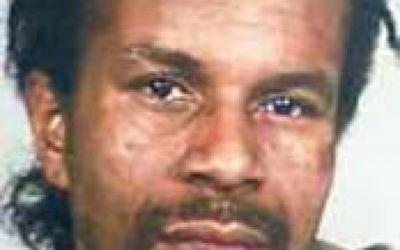Police Search for Gang Member Suspected in Murder
