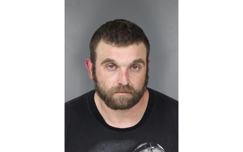 Elk River resident reports suspicious vehicle parked in his driveway; driver arrested on possession charges