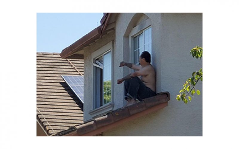 Erratic man gets on roof, rolls off into custody