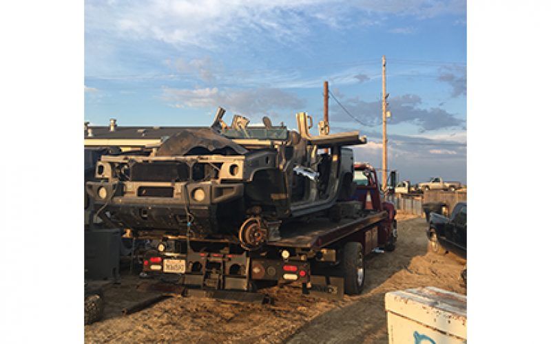 While Serving Arrest Warrant Police Discover Chop Shop