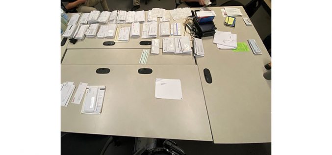 Couple with stolen car, stolen mail, fraudulent documents