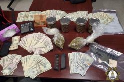Man flees vehicle stop with gun, drugs, cash