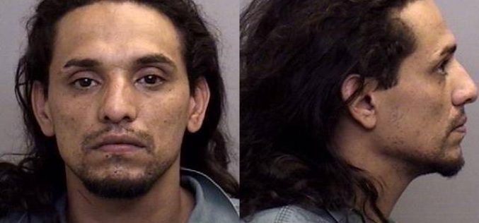 Vadalism report leads to arrest of man with active warrant