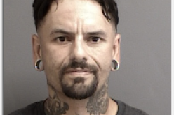 Parole check yields “numerous firearms and ammunition”