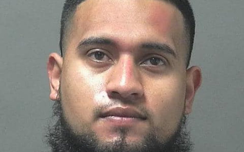 Gun-carrying motorcyclist speeds through stop sign and tries to escape