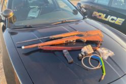 Search of trailer at encampment produces ammo, meth, two guns