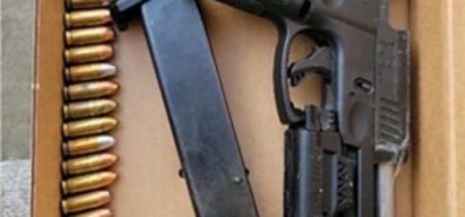 Two arrested with gun in their vehicle