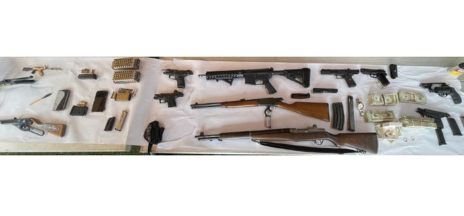 Parolee reportedly caught with nine guns in home