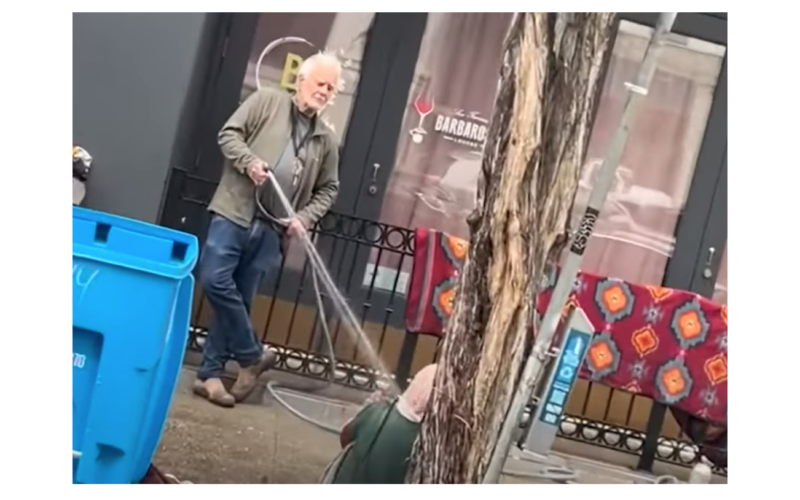 Art Gallery Owner Charged with Battery for Spraying Unhoused Woman with Hose
